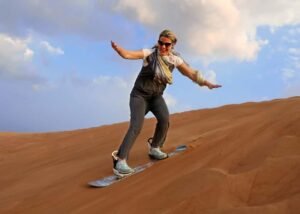 Sandboarding activity during a Dubai desert safari